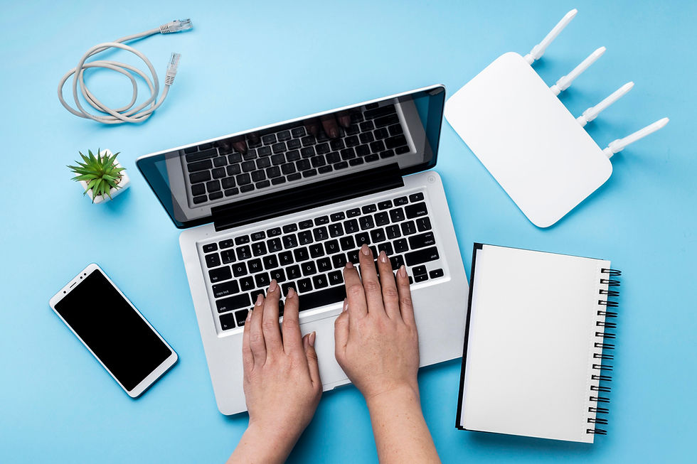 top-view-wi-fi-router-with-hands-using-laptop-smartphone.jpg