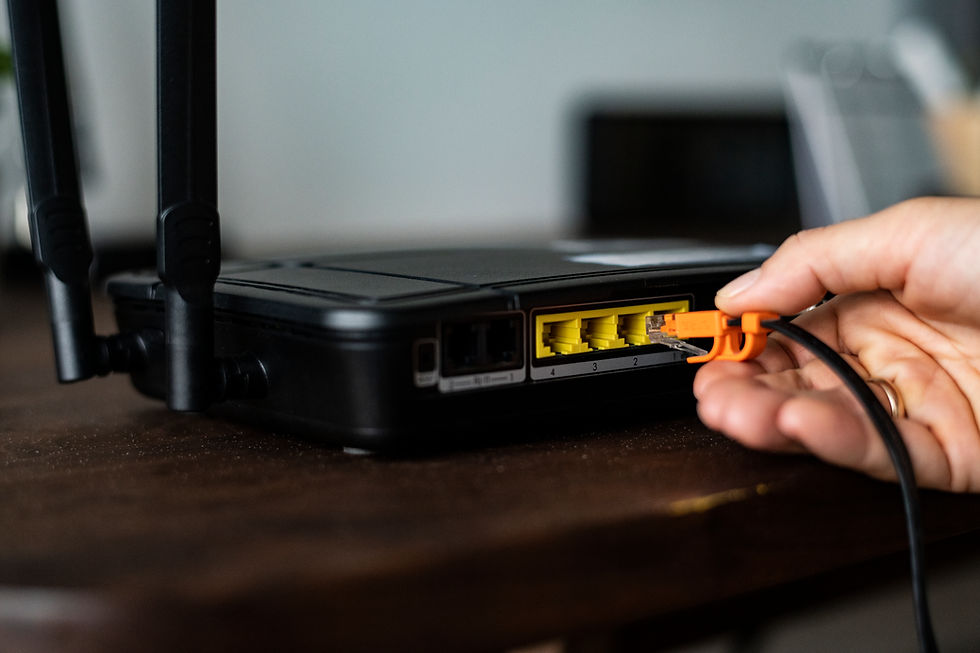 man-plugging-ethernet-cable-wireless-router.jpg