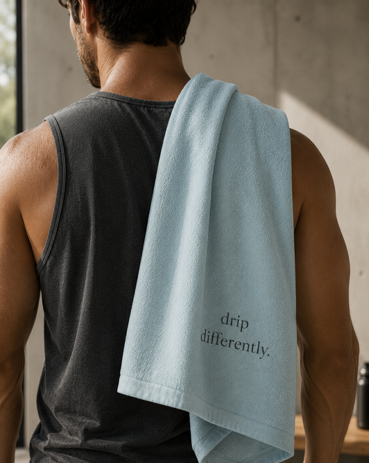 Aura Studio branded towel merchandise — wellness brand design by Boldery Toronto
