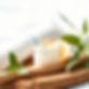 Bamboo toothbrush with toothpaste, lemon, and green leaves