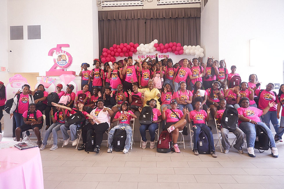 Thema Campbell (center), founder and CEO of Girl Power Rocks, poses with participants during the organization’s “It Takes a Village” Girls Summit, held recently at the Overtown Performing Arts Center in Miami. The event brought together participants in Girl Power Rocks programs for a day of leadership development, mentorship, team-building activities and a Back-to-School Shopping Experience sponsored by Kinnect. (Photo credit: Nu Age Productions)