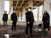 Akademia-Award-winning producer, engineer, and songwriter MATT MILLER side-steps these industry achievements to embark on something deeply introspective and personal; a transcendent, reactionary and vile personage embodying soaring progressive melodies and captivating crushing rhythms which engulf the listener in black clouds of desperation and shimmering hope.  Drawing upon the gut-wrenching timed-precision of European death metal stalwarts NECROPHAGIST and SPAWN OF POSSESSION, MATT MILLER progressively blends this approach with deep synthetic and symphonic atmospheres like that of DEVIN TOWNSEND, often arriving at surprisingly emotive and heart-clenching metallic passages like that of RIVERS OF NIHIL.  Calling upon other single-member death metal projects such as PUTRID PILE or INSIDIOUS DECREPANCY, the live performance can best be described as a reclaiming and repainting of the earth by a relentlessly sweeping and deranged berserker appealing to the vast minions of the extreme music.  The combination of elements within MATT MILLER distills the traditions of the international metal realm, the progressive atmospheres of modernity, and reactions to a vile world into a single unrelenting persona of despair and vengeance. MATT MILLER hails from the rain soaked northern Oregon Coast; influenced by the natural foreboding environment. Listen to the new MATT MILLER LP Fiber Tortmentum courtesy of Exitus Stratagem Records.
