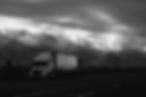 black-and-white-semi-truck-on-road.jpg