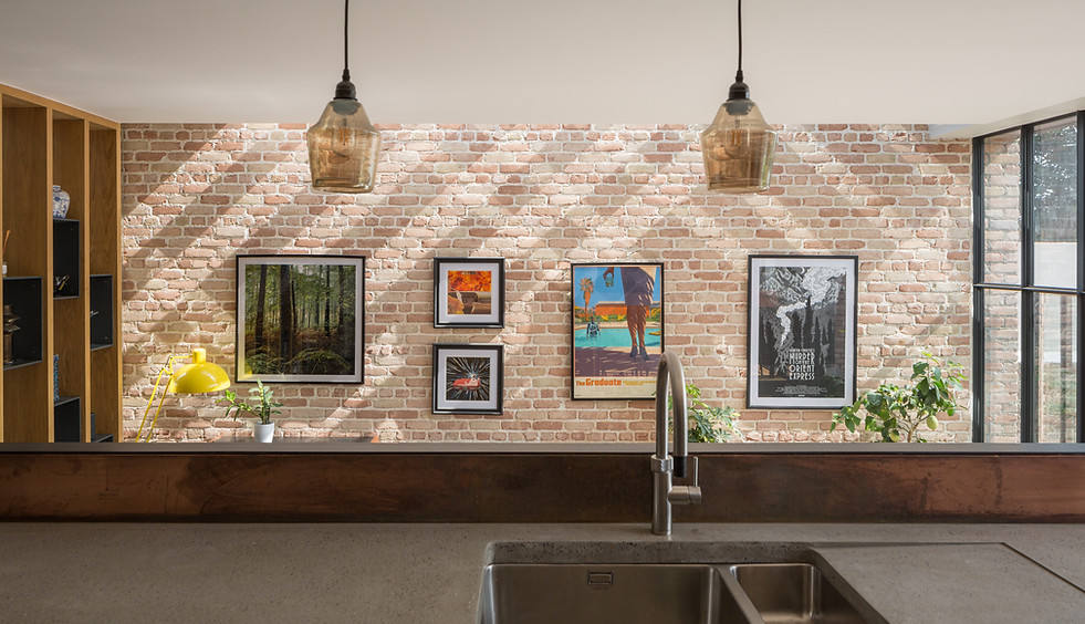 brick wall top lit concrete counter coppr splashback
