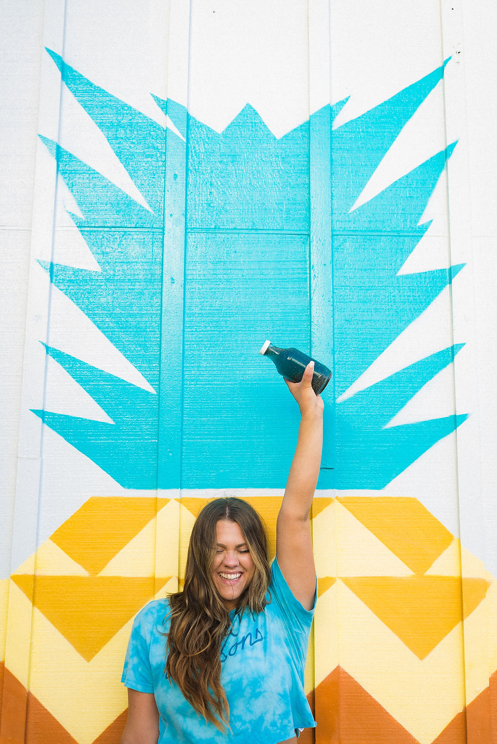 Woman holding juice in styled photo