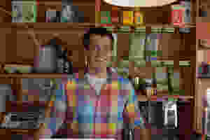 Nathaniel Pantalone standing in front of a tea counter in Dobrá Tea
