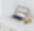 Laptop displaying a website on a white desk with fruit