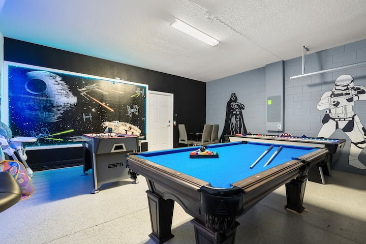 Star Wars game room with billiards and a stormtrooper mural