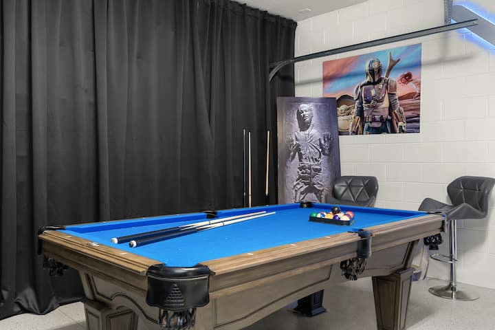Blue-felt pool table with Star Wars art