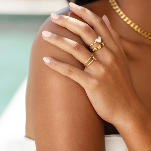 model wearing gold rings, multiple ring photography, jewellery photography, jewellery photographer uk, jewellery photoshoot Chocianaite Creative Agency, Chocianaite Jewellery Photography, Abbott Lyon Jewellery Photographer