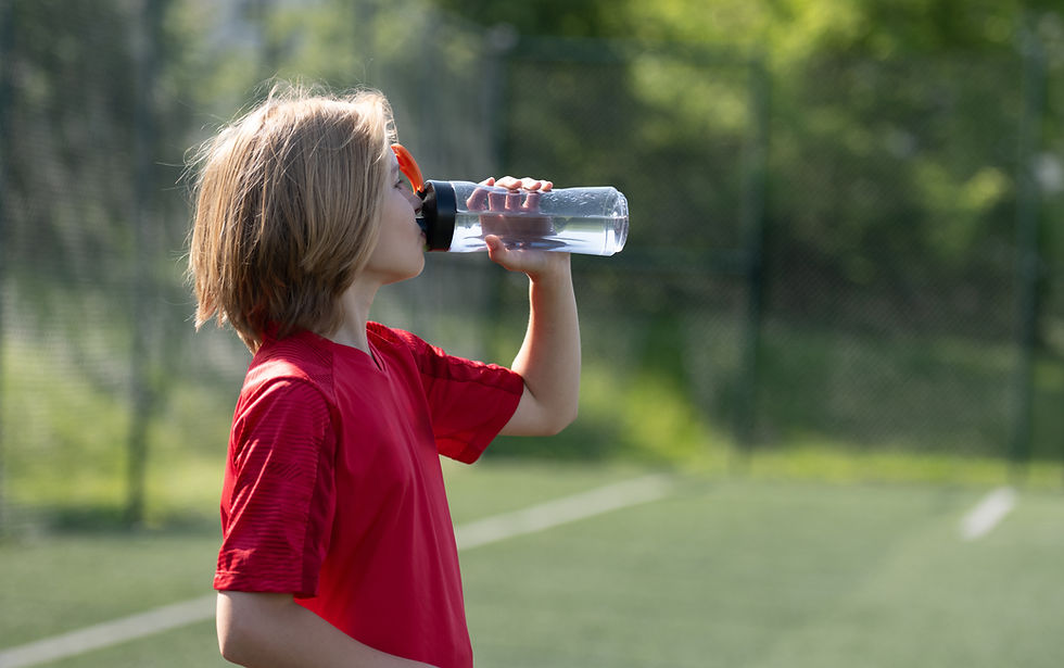 Young Athlete Drinking Water