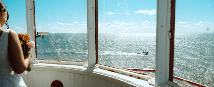 Elope inside a lighthouse at Sea Cow Head, PEI. Jane's Island Photography takes you on an adventure elopement.