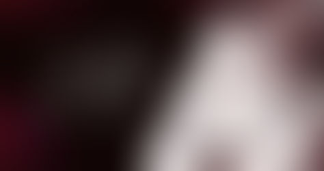 Woman wearing headphones, hands to ear, against a dark background. Text reads "Sallyb. Your Voice Coach." Mood is professional and focused.