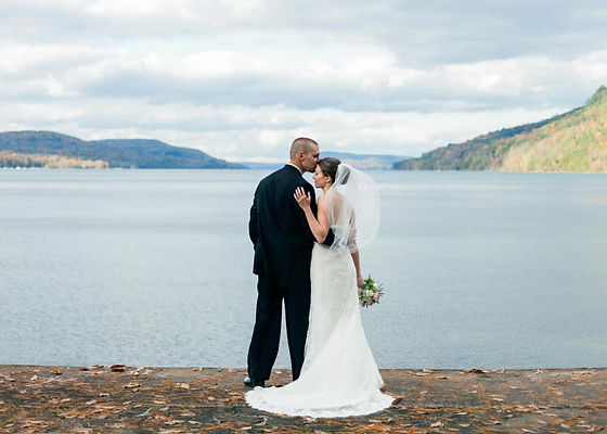 Bride and groom over looking Otsego Lake in Cooperstown, New York.