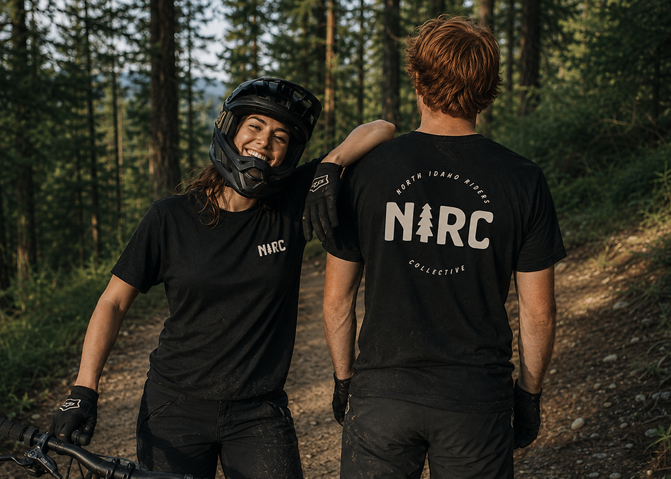 Mountain biking duo in forest trail.png
