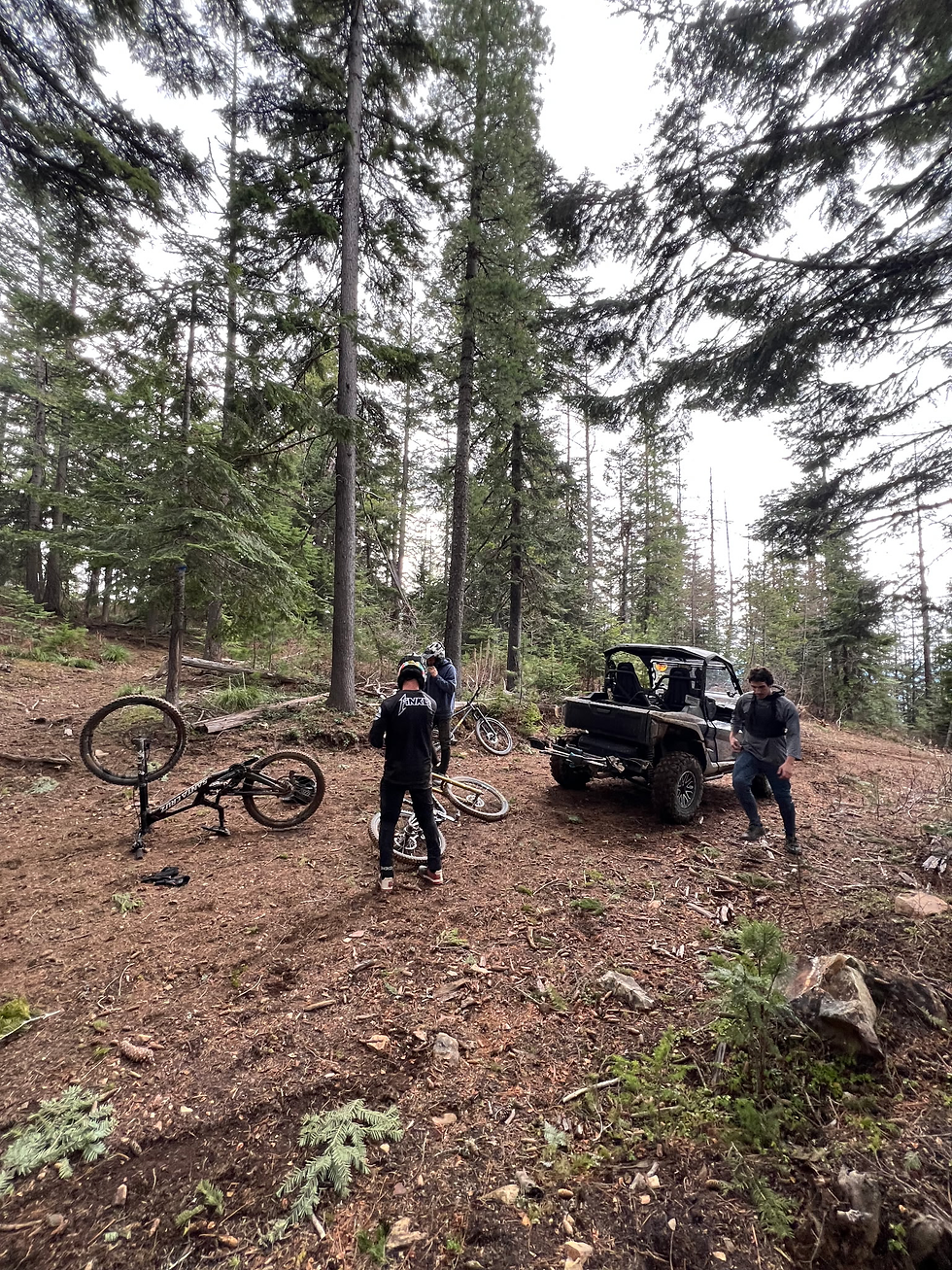 Group of Mountain bikers unloading at trail head