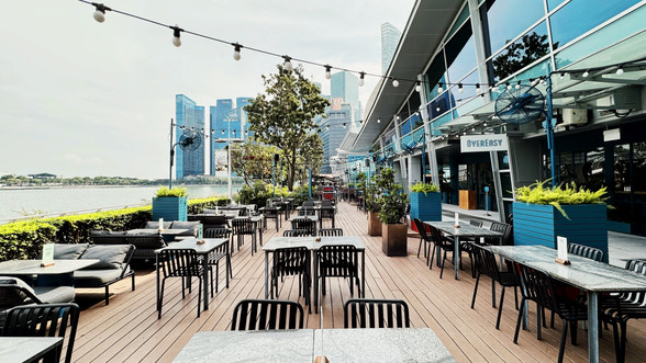 Waterfront outdoor seating overlooking Marina Bay Singapore