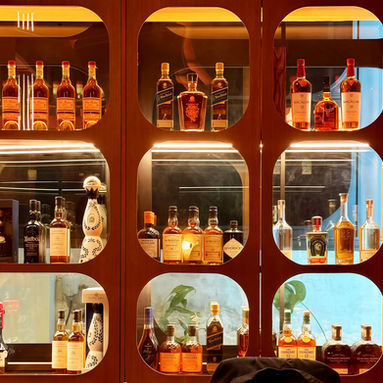 Wine display wall and hospitality interior detailing at Temper Wine Room & Lounge