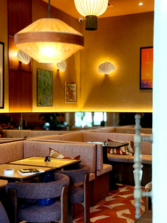 Contemporary riverside restaurant interior at Merci Marcel Robertson Quay