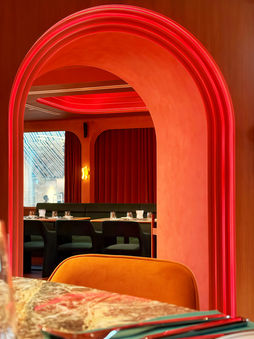 Contemporary hospitality interior with layered material palette and lounge seating