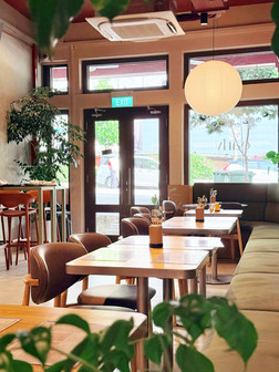 Contemporary cafe dining environment designed for social gathering in Singapore