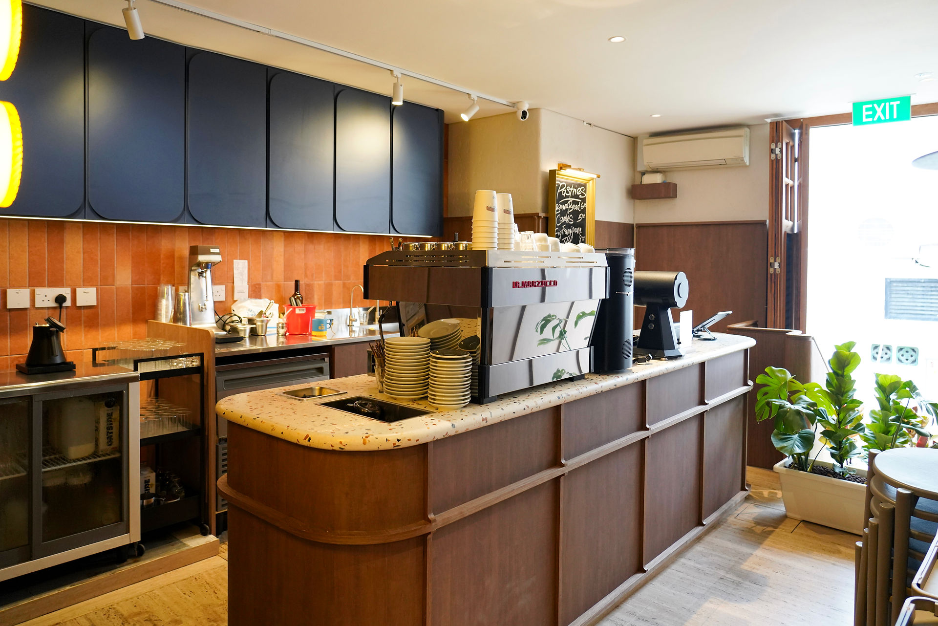 Counter seating surrounding filter brew station at Maxi Coffee Bar