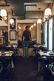Neighbourhood bistro seating arrangement inspired by classic French dining culture