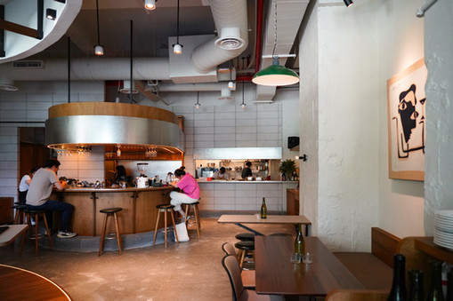 Layered ambient lighting creating warmth and atmosphere throughout the space