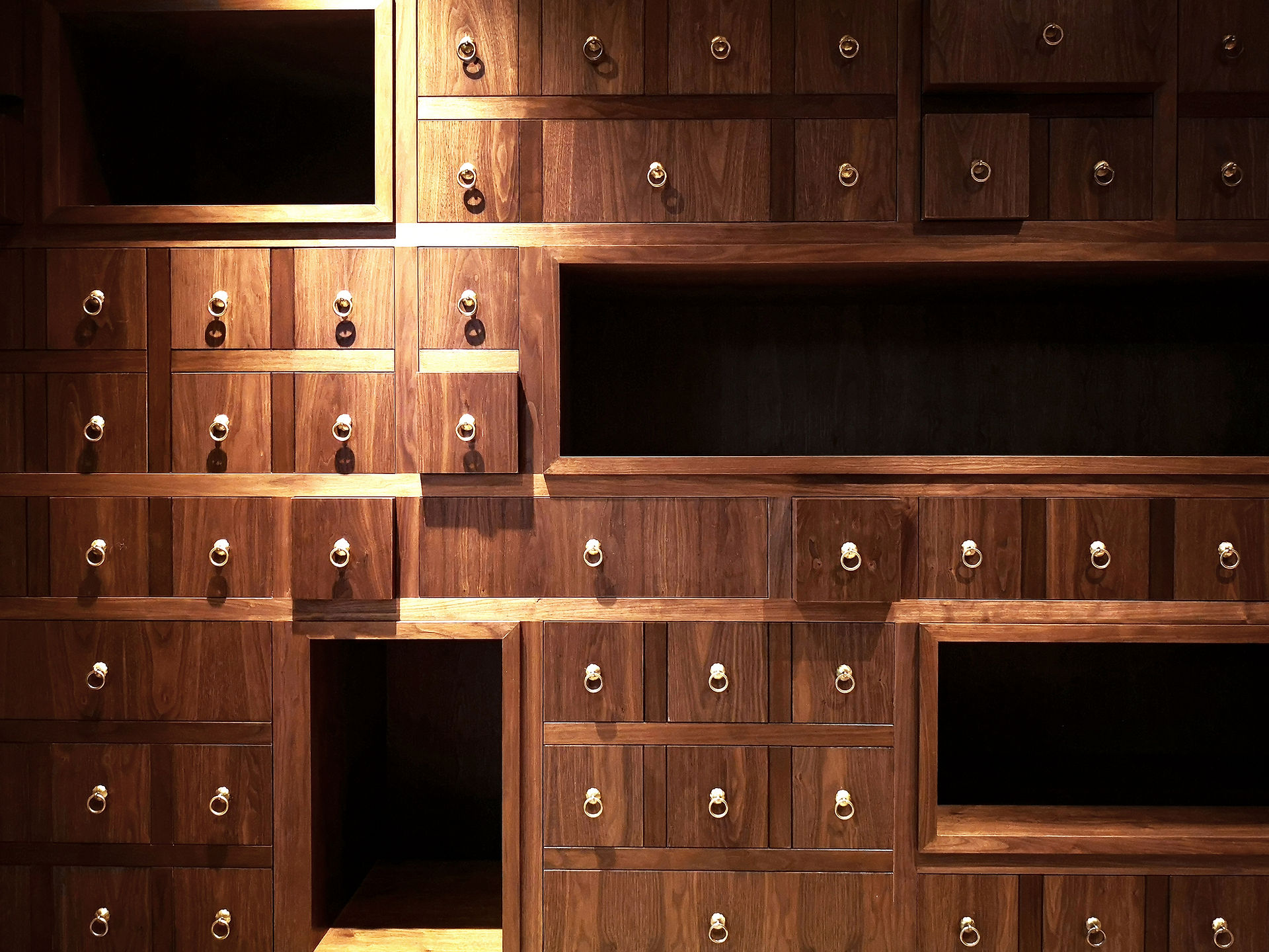 Warm lighting enhancing the richness of timber, brass and textured finishes