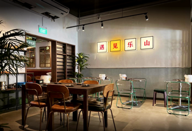 Retro lightbox signage integrated within contemporary Chinese restaurant interior