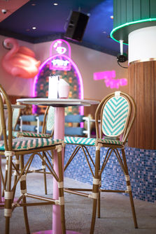 Warm ambient lighting enhancing the atmosphere of the tropical dining space