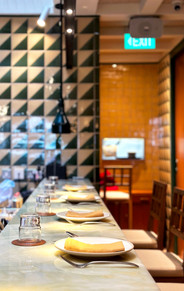 Hospitality bar and gathering environment within Burmese restaurant interior