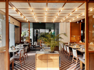 Comfortable dining seating arrangement within contemporary neighbourhood cafe