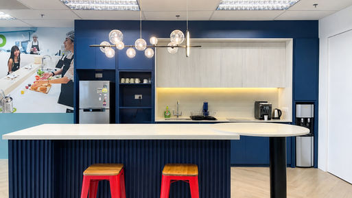 Layered blue tones and refined finishes throughout the workplace interior
