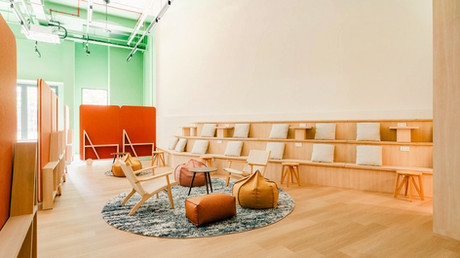 Open community foyer designed as a shared gathering space for youths and residents