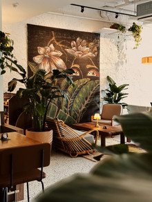 Relaxed communal seating arrangement within Mediterranean-inspired dining environment