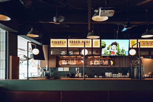 Social bar environment integrated within the casual dining experience