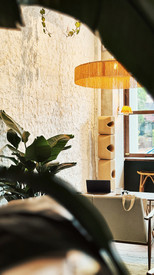 Tropical greenery incorporated throughout dining environment at Merci Marcel East Coast