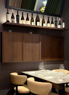 Ambient lighting and ceiling composition within contemporary grill-house interior