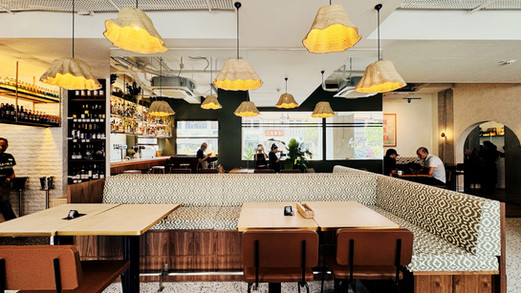 Seamless indoor and outdoor dining experience within French lifestyle cafe