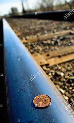 canadian-penny-on-rail-way-track-BMFFTT.