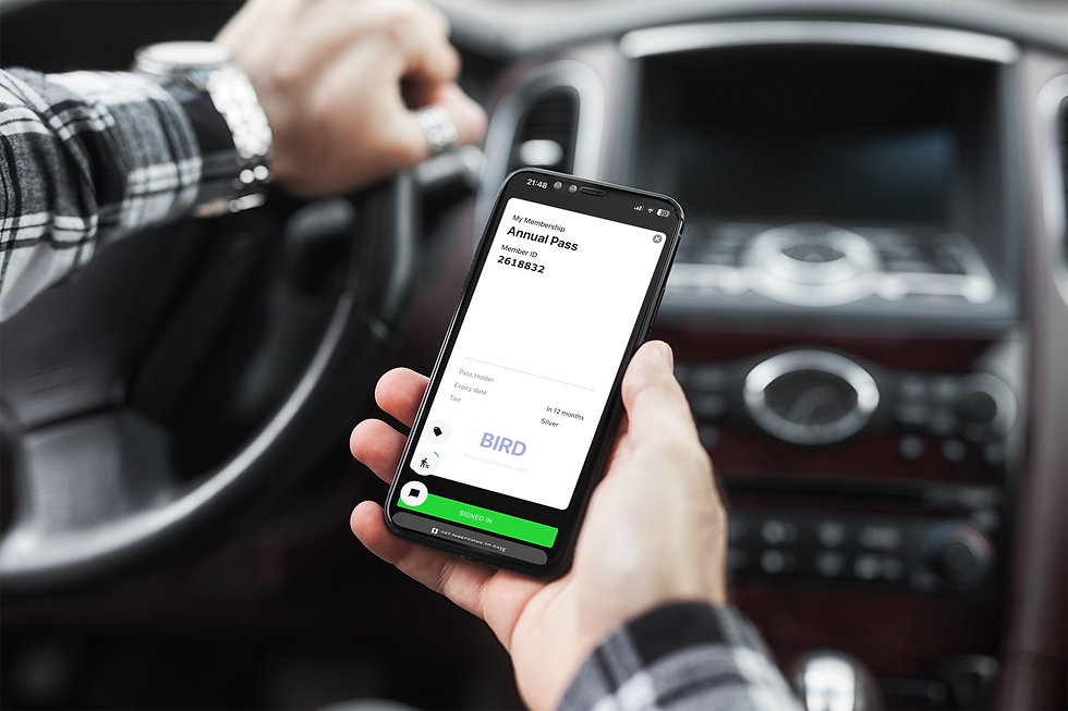 mockup-of-a-man-holding-an-iphone-11-pro-in-his-car-2120-el1 (1).png