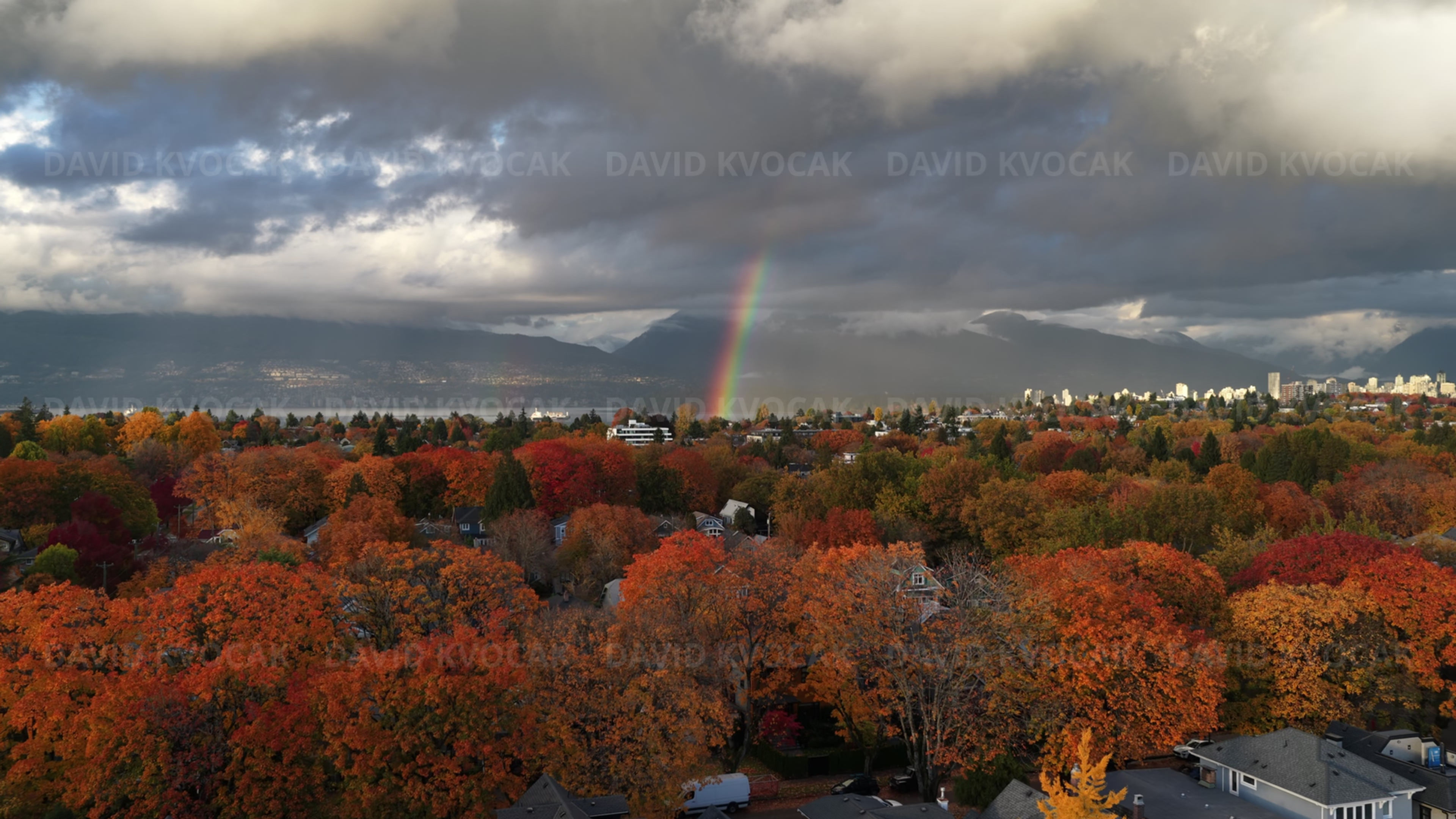Autumn rainbow over Vancouver, aerial drone footage