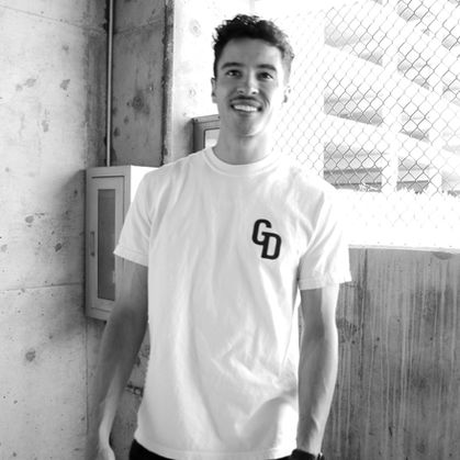 Giordan Thompson wearing branded GiorDior T-shirt with a big ol smile.