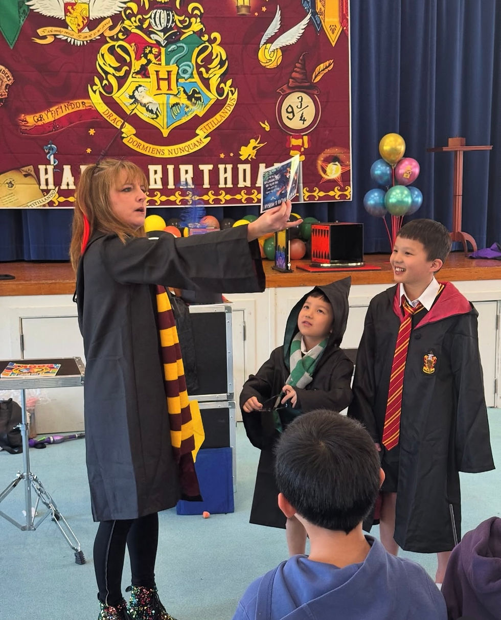 Kids entertainer Magic Mona involving children in an interactive magic show in Auckland