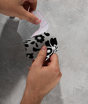 hands-putting-up-decorative-vinyl-top-view.jpg