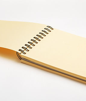 open-empty-spiral-bound-sketchbook-drawing-paper-notepadperspective-view.jpg
