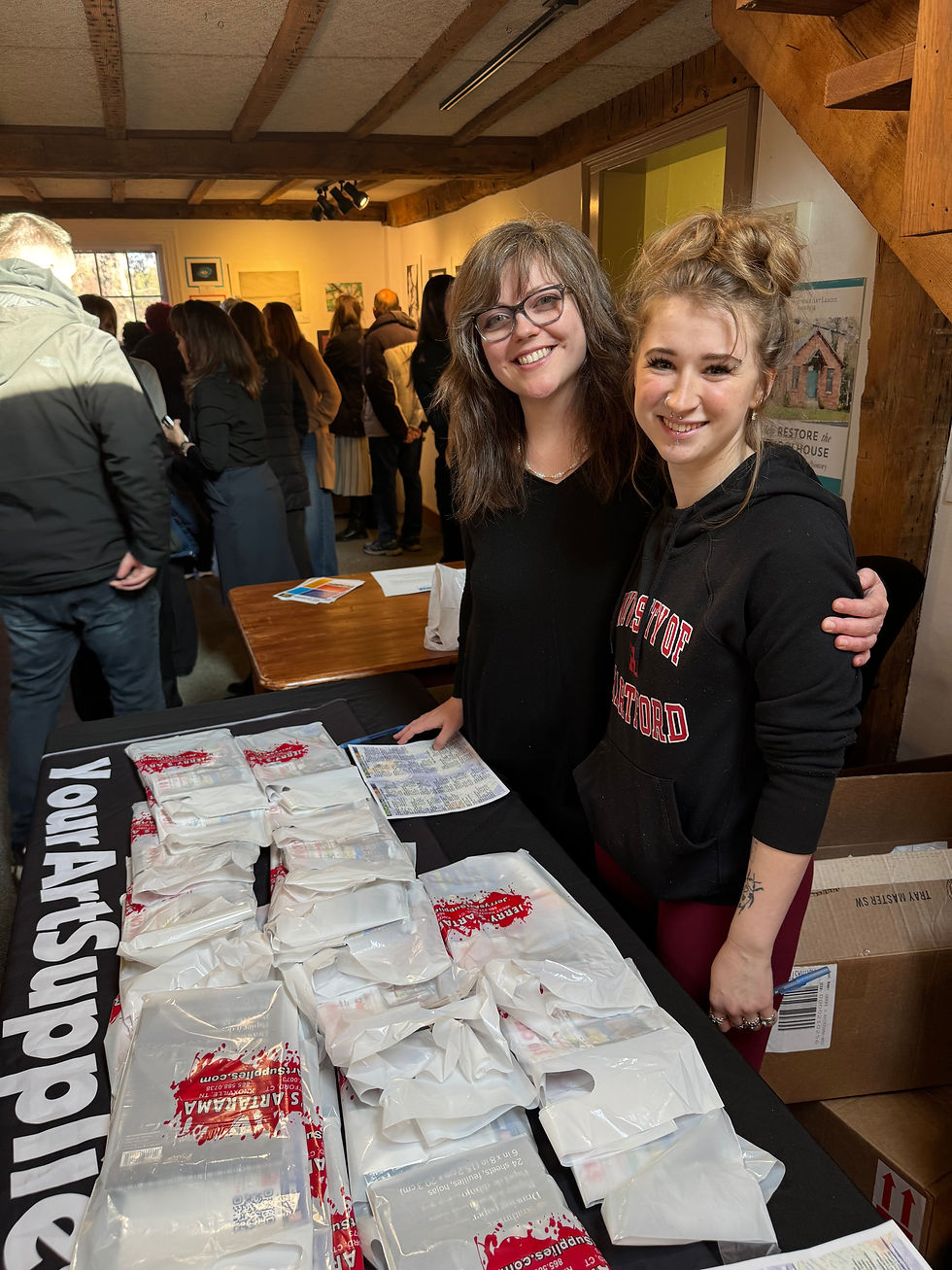 Jerry’s Artarama of West Hartford is a community partner of Artbeat 2026, giving participating students a bag of art supplies and coupons to use in the store. From left, store manager Chelsea Lundeberg and store associate Ella Thayer. “We do this every year,” Chelsea said. “We love it.”