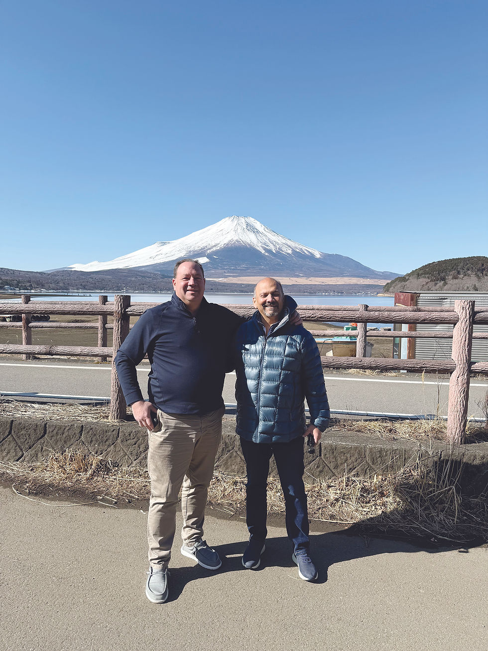 Documenting their trip with iconic backgrounds. Tuchmann and Doshi are at Mount Fuji in Japan.