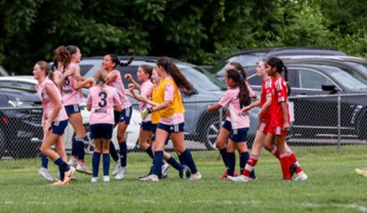 Players celebrate after scoring a goal. (submitted)